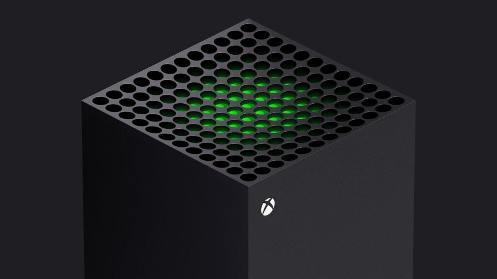 Vue latérale avant supérieure d'une Xbox grise debout sur un fond noir