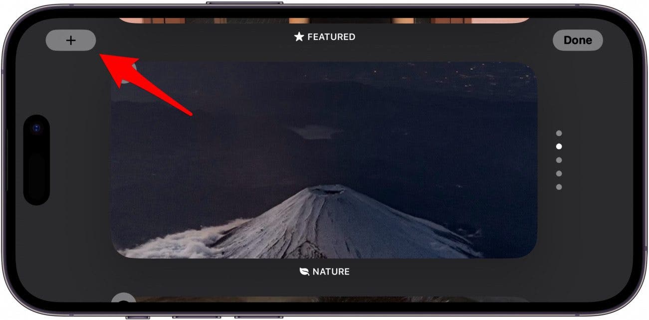écran de photos de veille iphone avec flèche rouge pointant vers l'icône plus