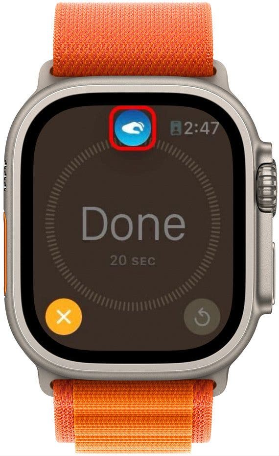Écran de minuterie Apple Watch terminé avec un arrière-plan grisé, le bouton d'arrêt en surbrillance et un cercle rouge autour de l'icône en appuyant deux fois en haut de l'écran